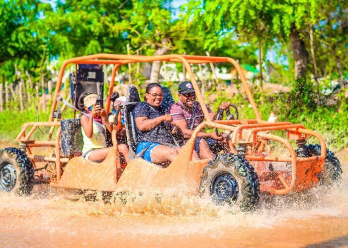 Tourists enjoying buggy tour adventure in Punta Cana mud with taxiboat tour operator