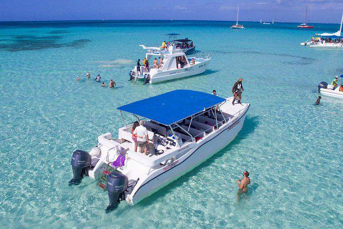 Taxiboat Punta Cana tour boats in crystal clear turquoise waters with tourists enjoying water activities